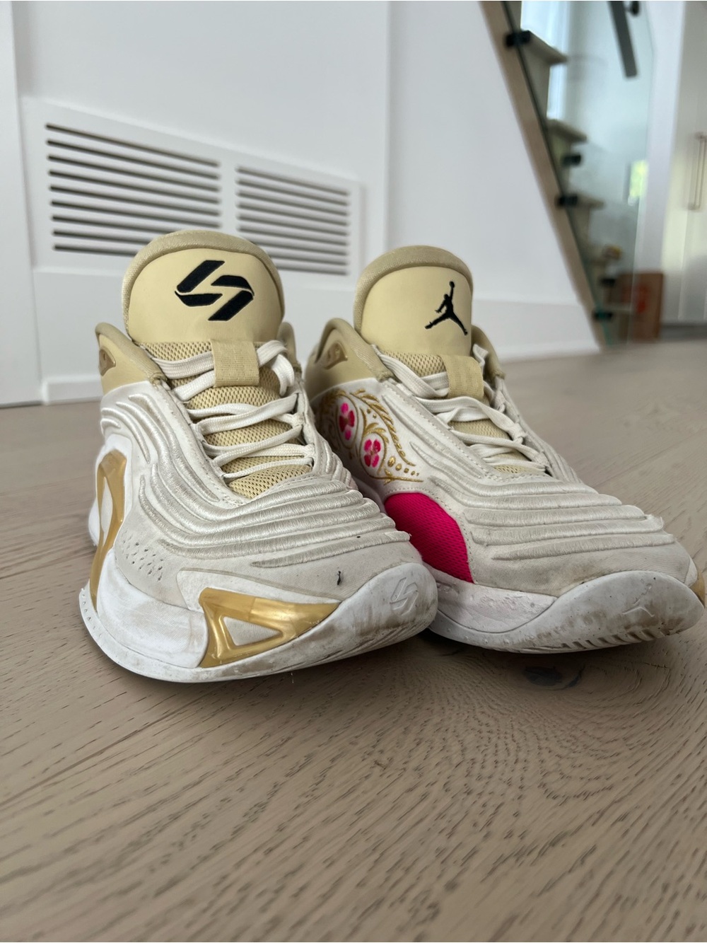 Jordan Women’s Cream and Gold Sneakers with Pink Accent